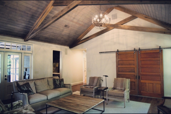 Sinker Heart Pine trusses, reclaimed Oak floors, & reclaimed Oak wall paneling supplied by Evolutia!